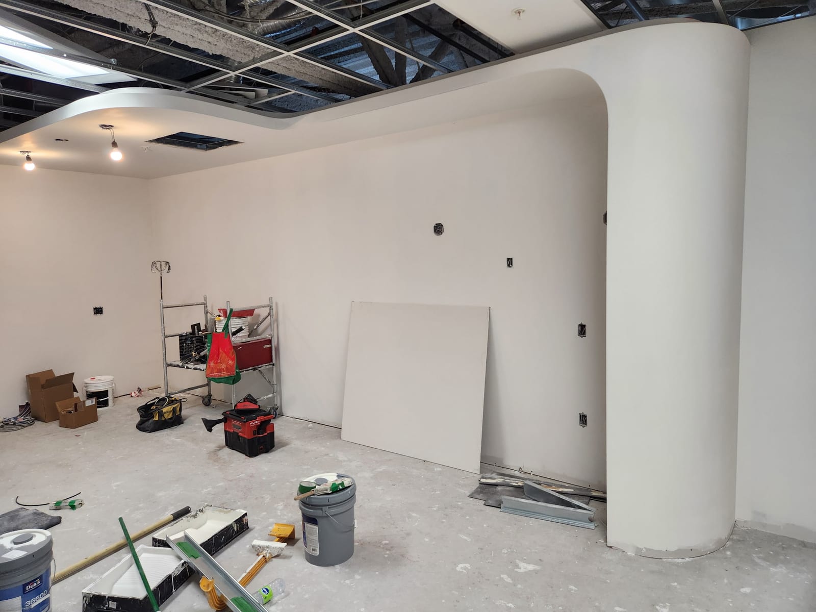 Residential interior finish: curved bulkheads & T-bar, Residential · drywall · taping & mudding · metal framing · T-bar project in Milton & GTA